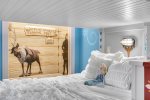 The bottom bunk features a full size bed and top bunk is a twin